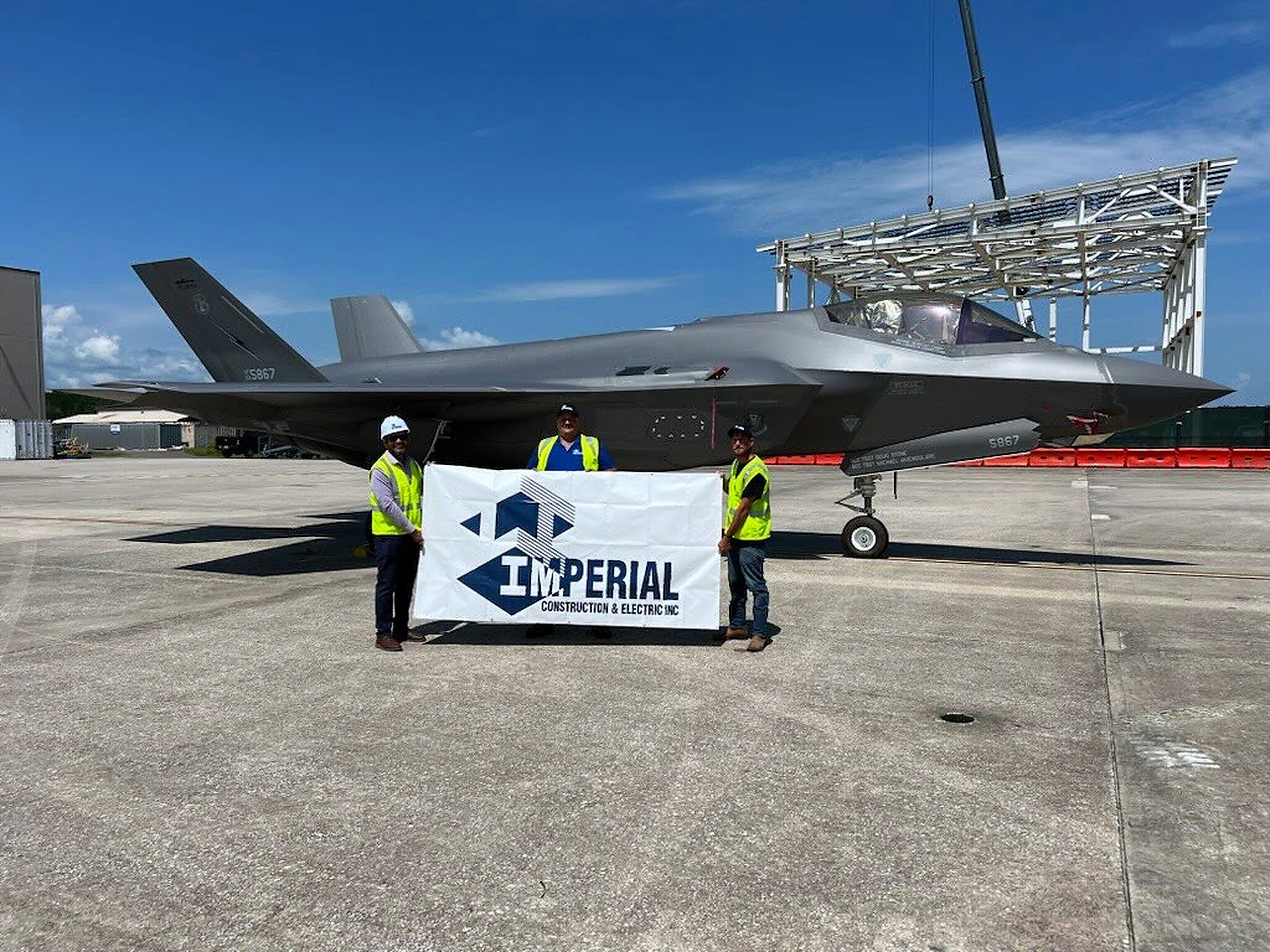 New hangar structural steel rising behind the F-35 at Building 1001